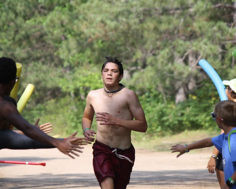 A Scout running in the iron Scout, a race at camp