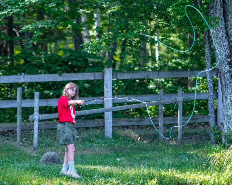 A Scout casting their fishing rod